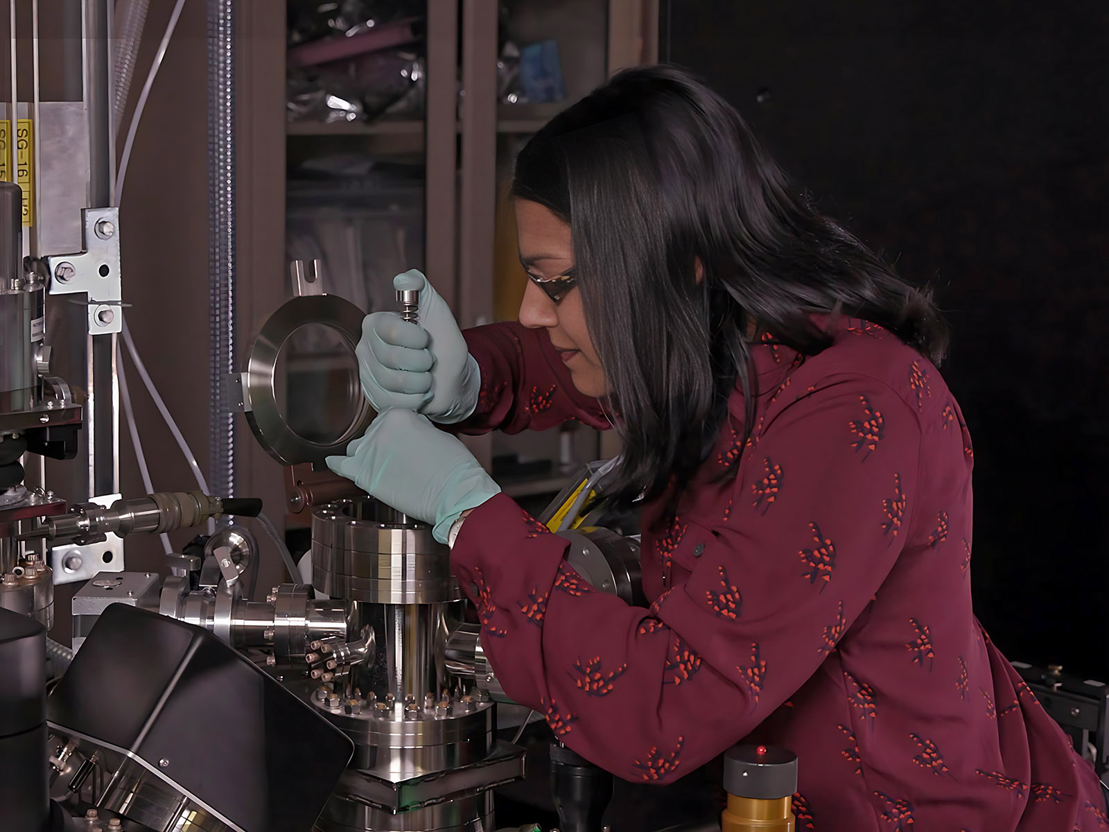 Sandra Taylor loads a sample into an atom probe tomography instrument