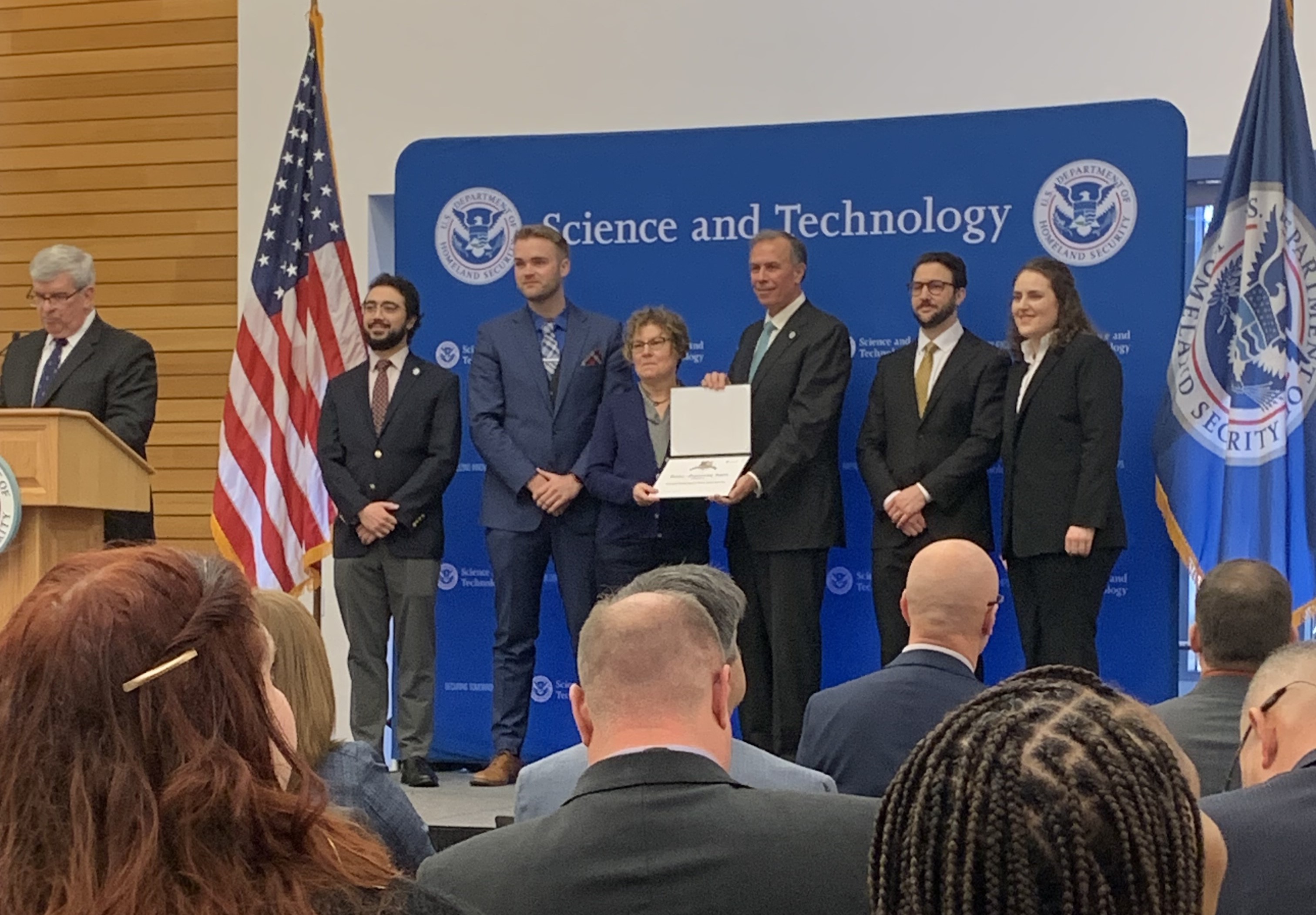 Photo of team accepting award from DHS S&T Under Secretary