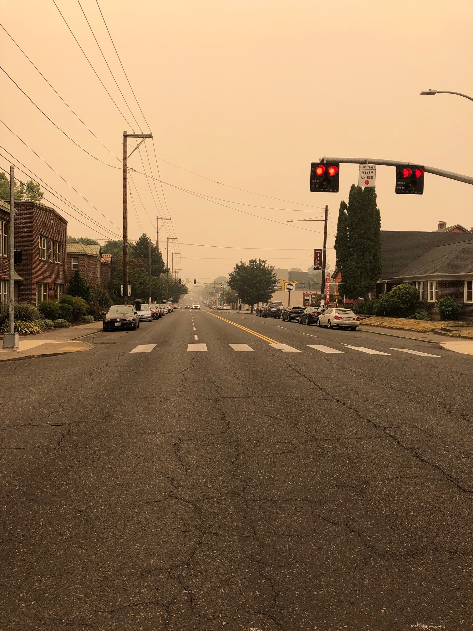 This image depicts a smoky sky above Hawthorne Boulevard in Portland, Oregon, during the 2020 fire season. 