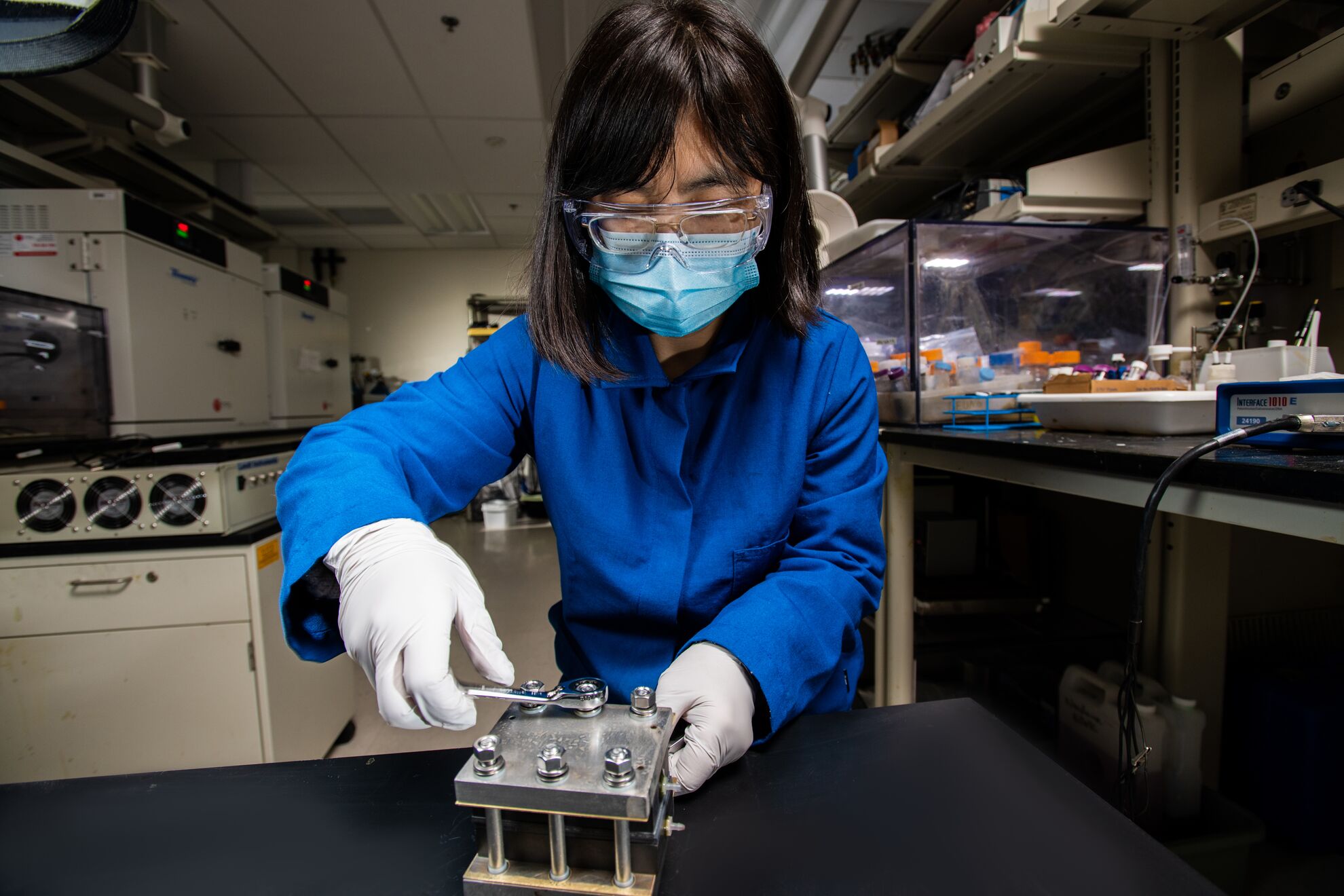 Researcher assembling a flow battery