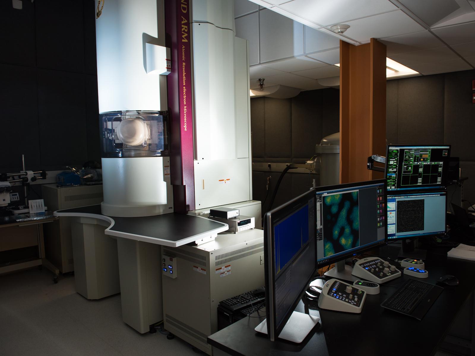 Large scientific microscope in research lab.