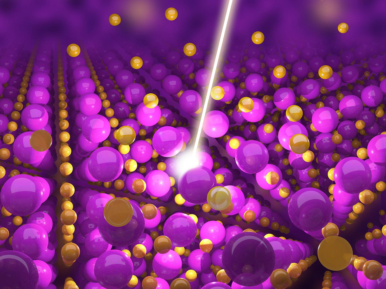 Purple and gold atoms show the structure of uranium dioxide.