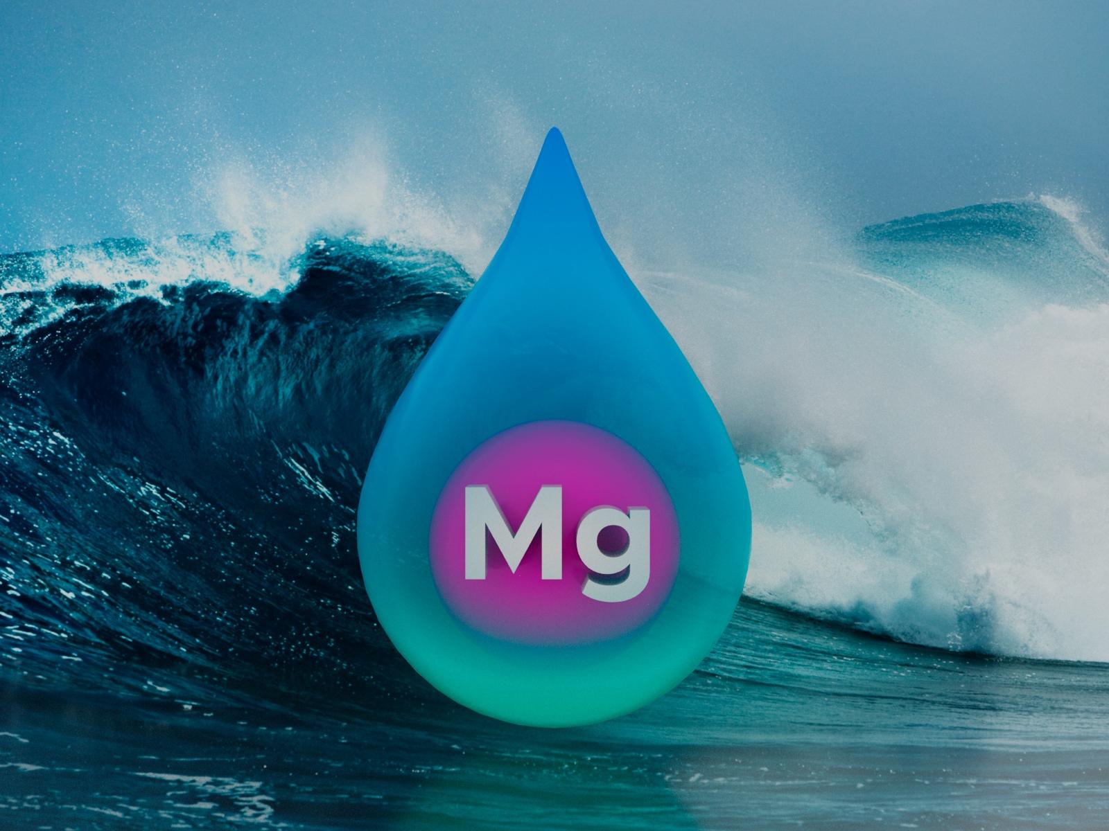A droplet of water containing a sphere labeled magnesium superimposed on a photograph of a wave