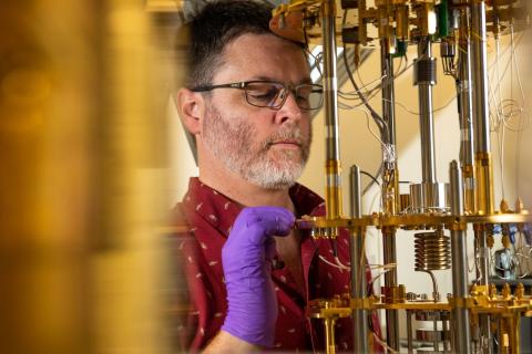 PNNL researchers use cryogenic devices such as dilution refrigerators to understand quantum mechanical phenomena at extremely low temperatures