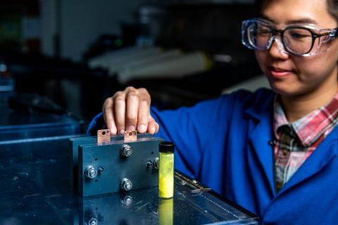 Researcher working on battery stack