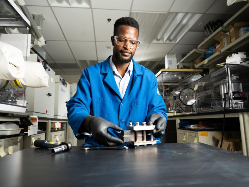 Lead author and battery researcher Gabriel Nambafu assembles a test flow battery apparatus