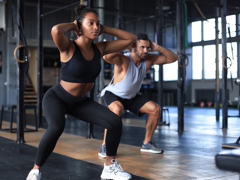 A woman and a man exercising