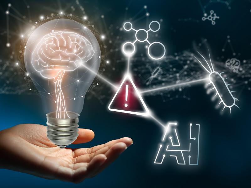 Digital image of a hand holding a lightbulb with a brain in it, which is connected by a strand of light to an exclamation point, a group of circles, an insect, and the word "AI" (Artificial Intelligence.)