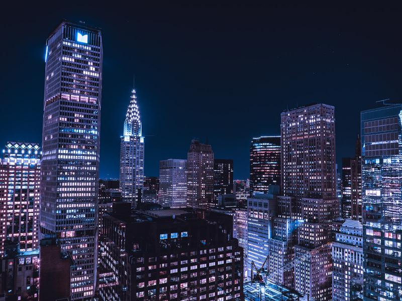 Buildings in New York City lit up at night