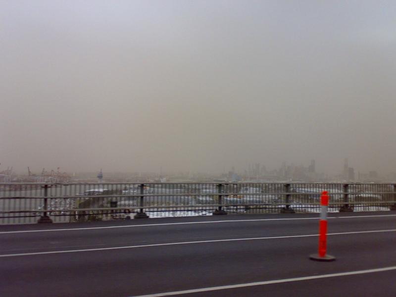 Photograph of a hazy, dusty harbor